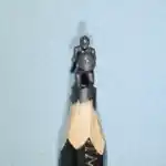 Captain America - Figurine miniature représentant Captain American tenant un bouclier rond orné d'une étoile.