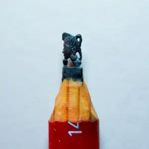 Statue Africaine - Cette mine représente une statue africaine. C'est le visage d'une femme de profil.