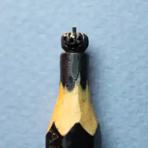 Citrouille - Cette mine représente une citrouille d'Halloween souriante.